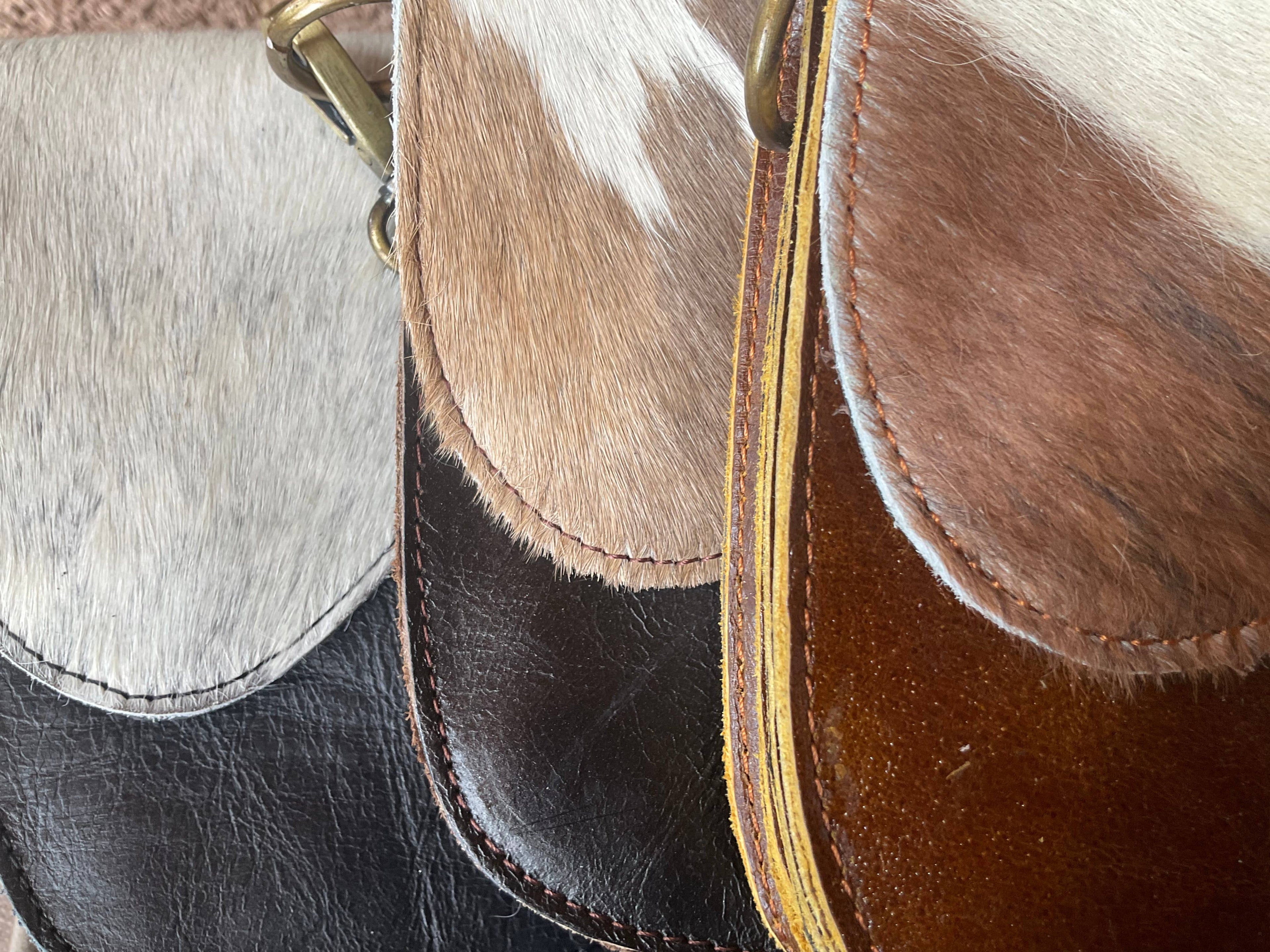 The English Saddle Cowhide Crossbody